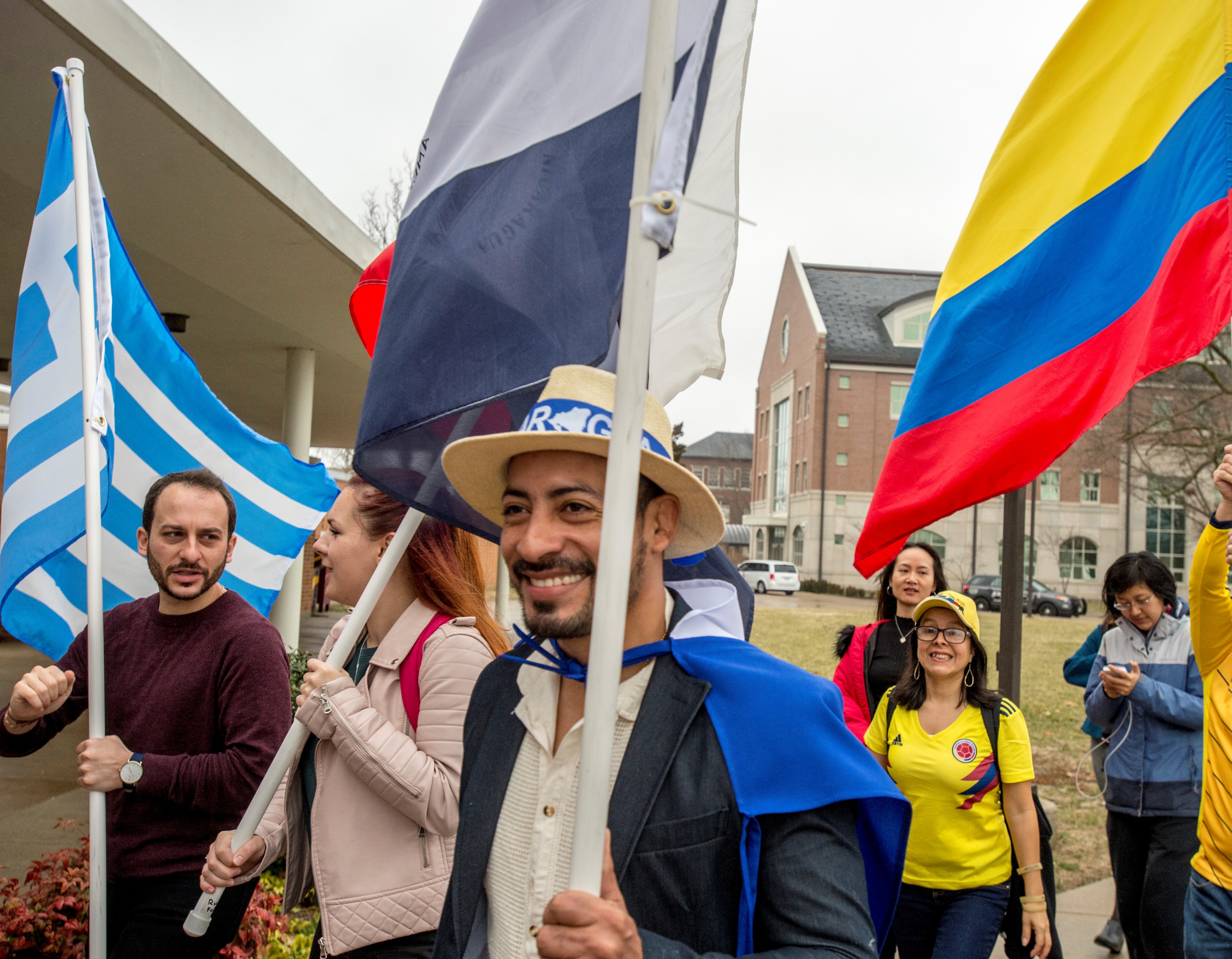 SIU students gathered on campus waving international flags in celebration